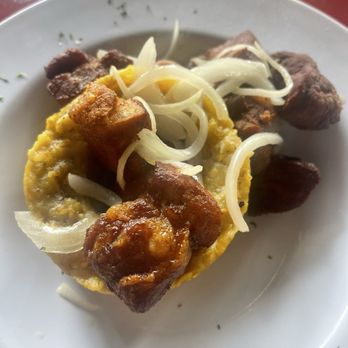 Casa Vieja - Kissimmee Florida signature dishes Mofongo Relleno de Pollo SalteadoArroz MamposteaoChuletas Fritas